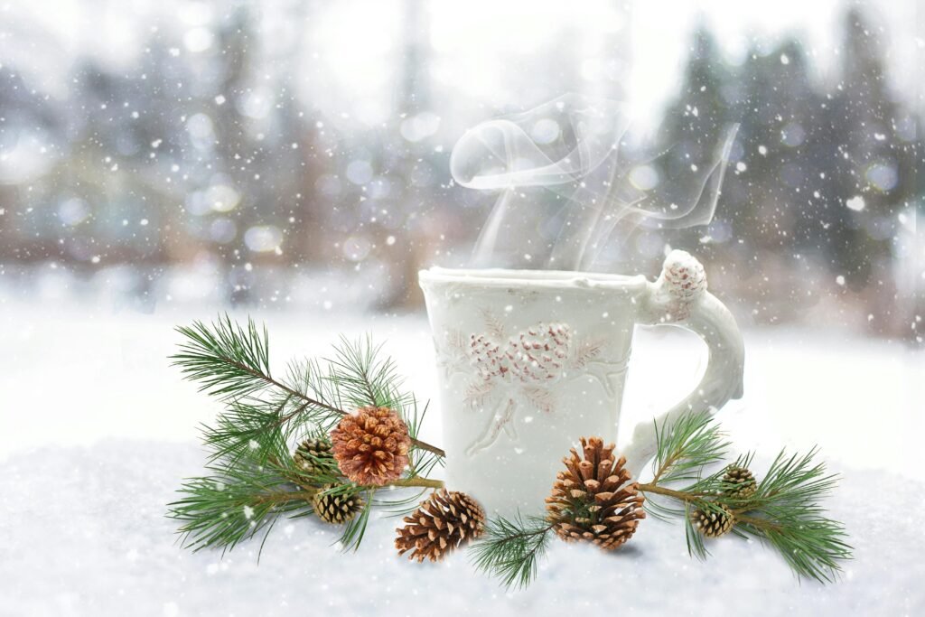 A steaming mug surrounded by pine branches and pinecones in a snowy winter landscape. dibesity berberine tea vs lipton tea