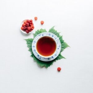 round white cup with saucer filled with red liquid